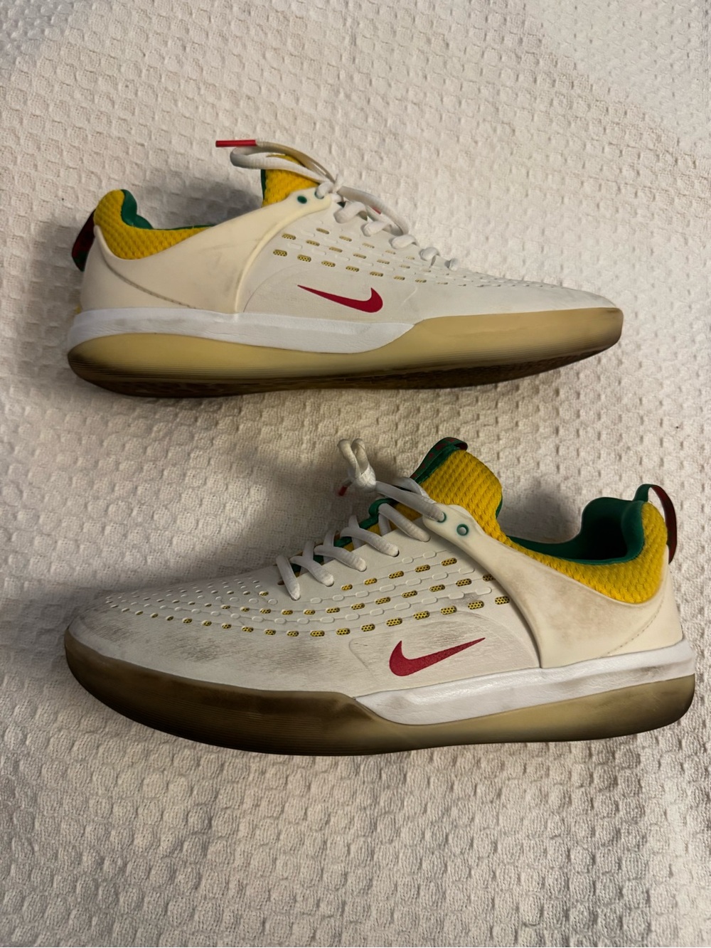 Nike Men’s White Sneakers with Red Swoosh and Yellow/Green Accents